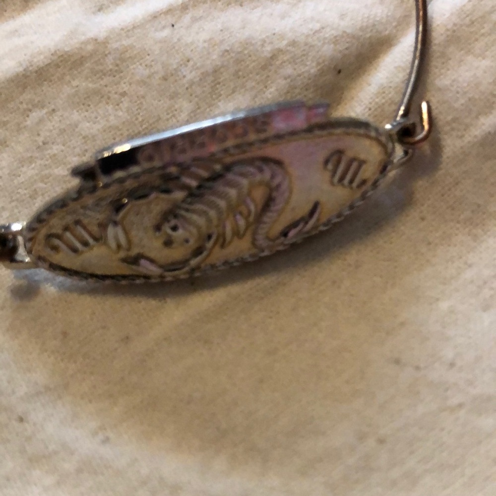 Gold Scorpio bracelet.